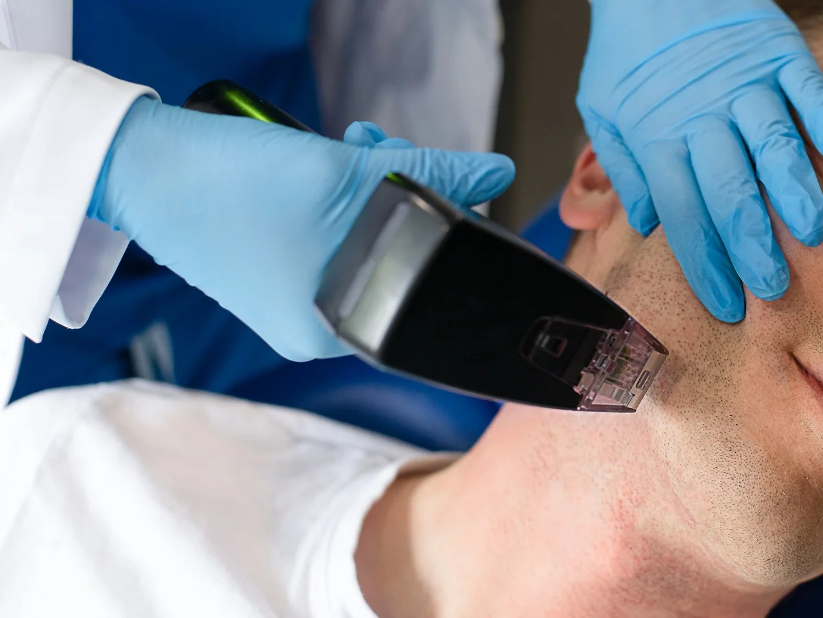 Man getting beard shaved